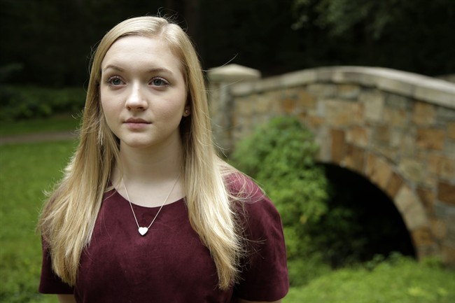In this Tuesday, Aug. 8, 2017 photo Kianna Kaizer, of Walpole, Mass., girlfriend of 22-year-old murder victim Jeremy Himmelman, stands for a photograph in a park, in Walpole.
