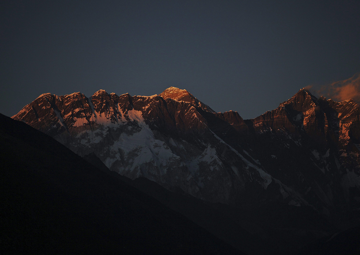 In this Feb. 18, 2016 file photo, Mount Everest, center, and Mount Lhotse, right, are seen from Tengboche, Nepal. 