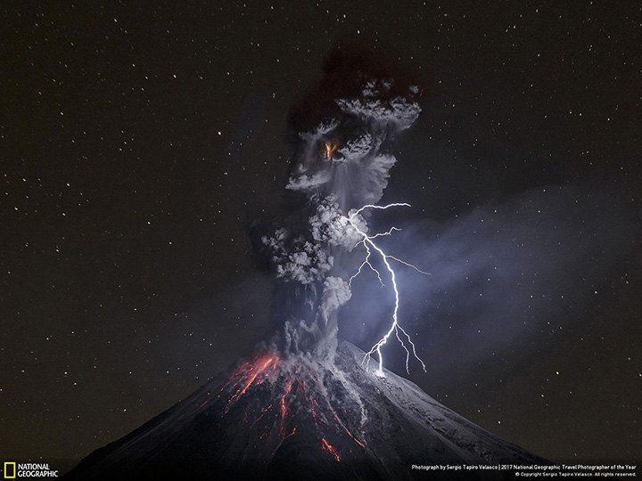 A powerful eruption illuminates the slopes of Mexico’s Colima Volcano on December 13, 2015. 