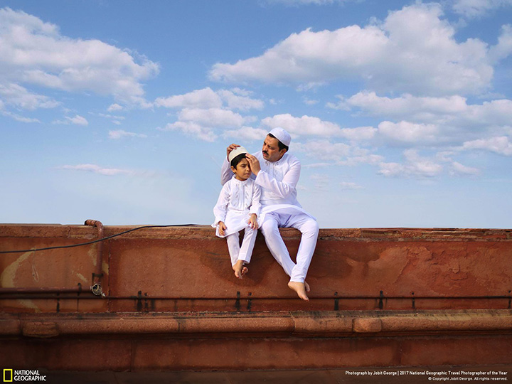 Honourable mention, People: A father and son dressed in traditional white clothing sit at a mosque in New Delhi, India.
