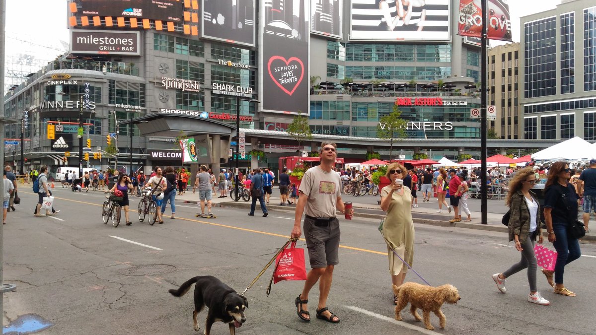 Pedestrians take to the streets near Yonge-Dundas Square during Open Streets TO in a 2016 file photo.