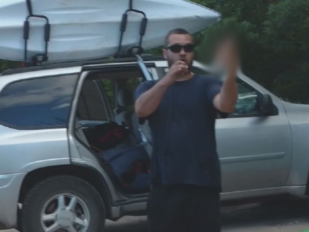 A still taken from a video posted by Kaniz Fatima shows a man giving the finger to the camera in July.