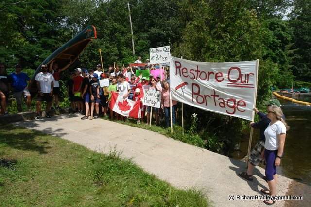 Protesters gathered at Moore Falls to protest the closure of an under-highway portage between Gull Lake and Moore Lake.