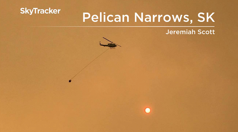 A helicopter fighting fires in the Pelican Narrows area.
