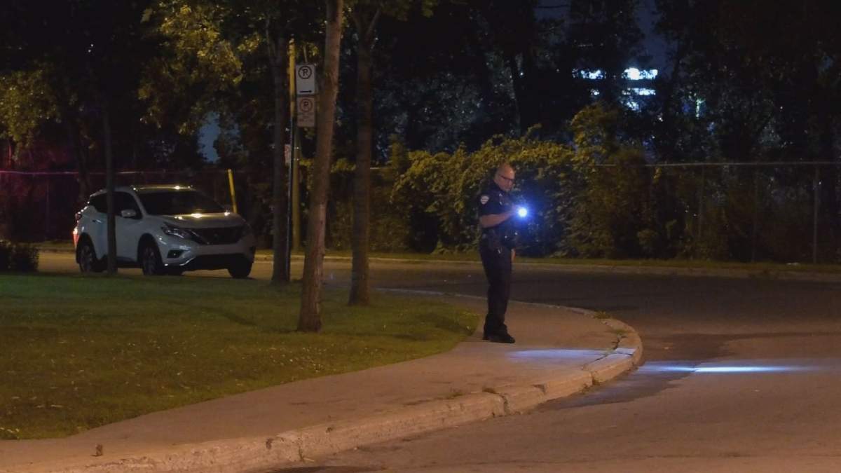 A 55-year-old woman was struck by a pickup truck as she was getting into her parked car.