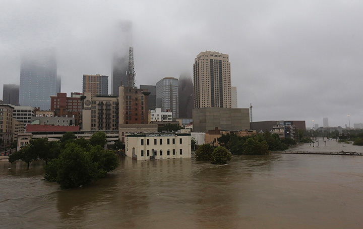 Floodwaters from Tropical Storm Harvey flow in the Buffalo Bayou in downtown Houston, Texas, Monday, Aug. 28, 2017.