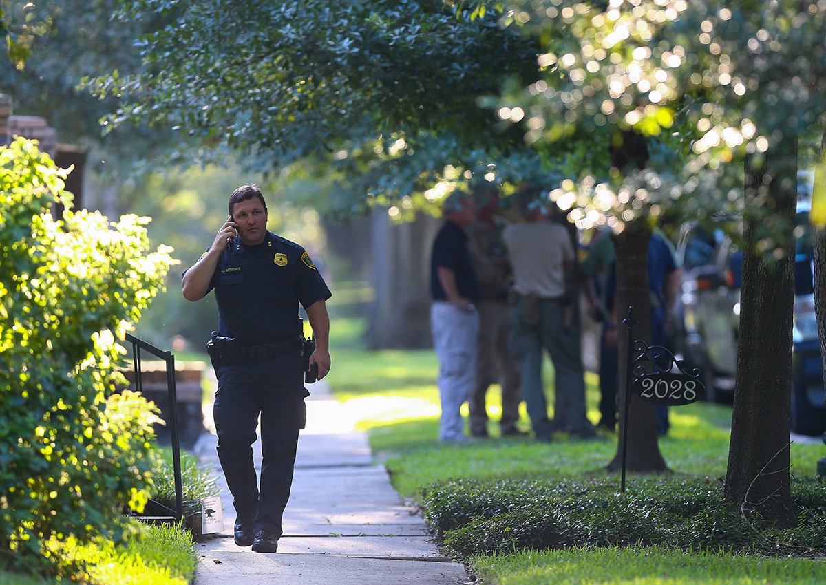 Houston Police Assistant Chief Larry Satterwhite, in charge of the Homeland Security Command, works at the scene of a "law enforcement operation" led by the FBI on the 2000 block of Albans Road Monday, Aug. 21, 2017, in Houston. 