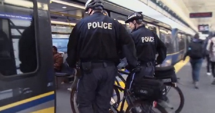 Two men are facing charges in separate alleged assaults on transit police officers .