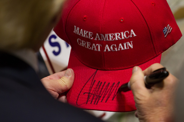 U.S. Donald Trump signs a "Make America Great Again" hat on April 15, 2016 in Hartford, Connecticut. The 2016 Connecticut .