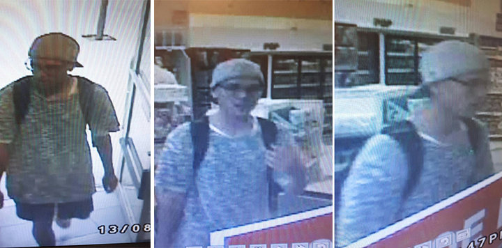 Security camera image of man wanted in bomb threat investigation.