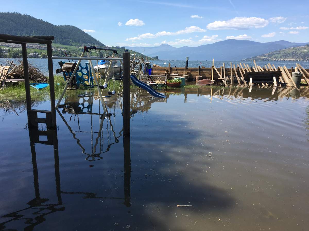 Flooding caused serious damage in communities around the Okanagan. In this file photo from May, flood water fills a Vernon yard. 