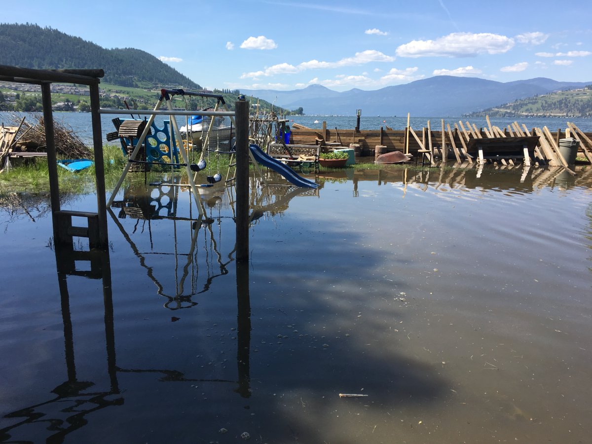 Flooding caused serious damage in communities around the Okanagan. In this file photo from May, flood water fills a Vernon yard. 