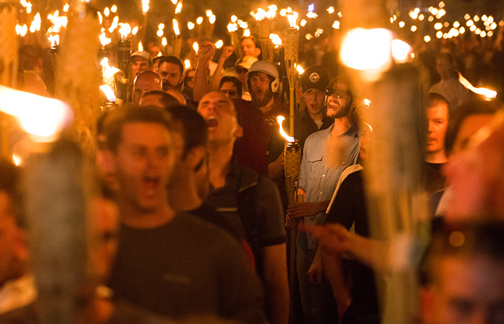 White nationalists march with Tiki torches through the University of Virginia campus the night before the ‘Unite the Right’ rally in Charlottesville, VA. on August 11, 2017.