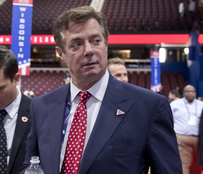 In this July 18, 2016 file photo, then-Trump campaign chairman Paul Manafort walks around the convention floor before the opening session of the Republican National Convention in Cleveland.