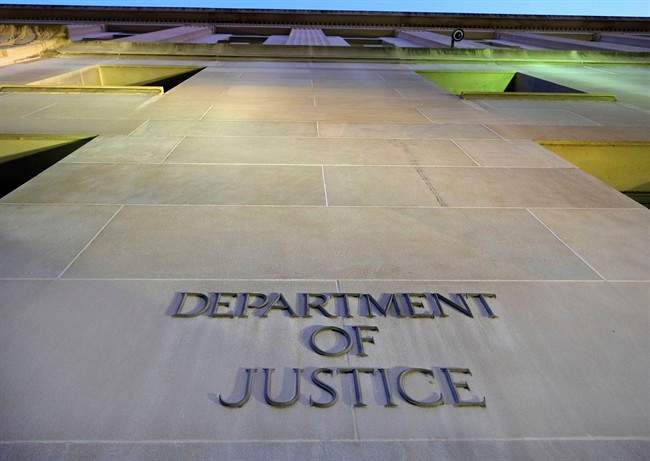FILE - In this May 14, 2013 file photo, the Justice Department headquarters building in Washington. 