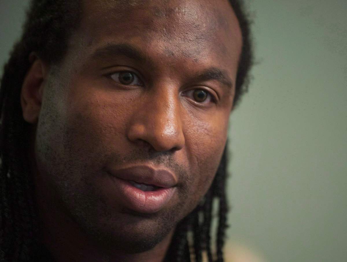 FILE: Former NHL tough guy Georges Laraque speaks at a news conference in Montreal, Friday, October 18, 2013.