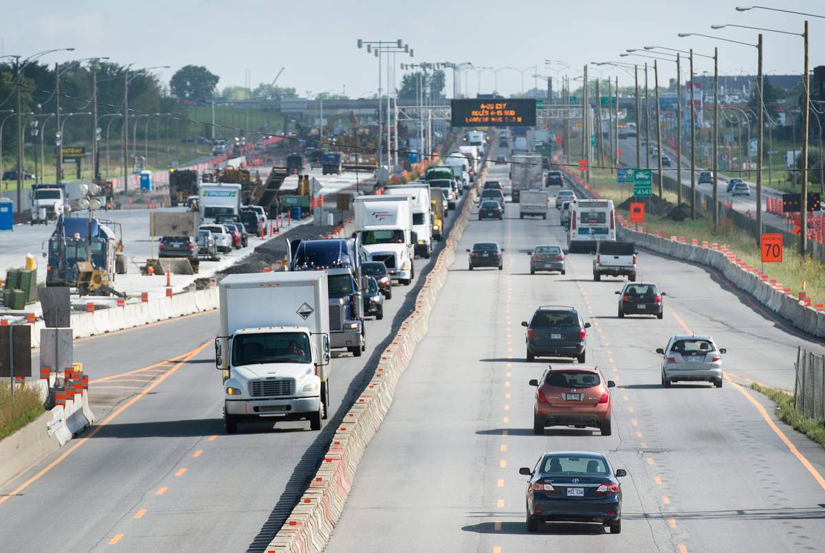 Motorists drive through a construction zone on highway 40 in Montreal, Wednesday, September 3, 2014.