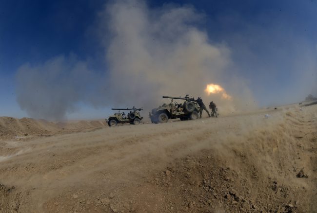 Iraqi pro-government forces advance towards the UNESCO-listed ancient city of Hatra, southwest of the northern city of Mosul, during an offensive to retake the area from ISIS group fighters on April 26, 2017.