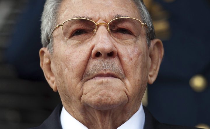 FILE - In this March 17, 2015 file photo, Cuba's President Raul Castro listens to the playing of national hymns during his welcoming ceremony at Miraflores presidential palace before the start of an emergency ALBA meeting in Caracas, Venezuela.