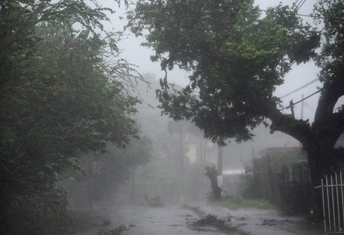 High winds and rain sweep through the streets of the Matelnillo community during the passage of Hurricane Irma, in Fajardo, Puerto Rico.