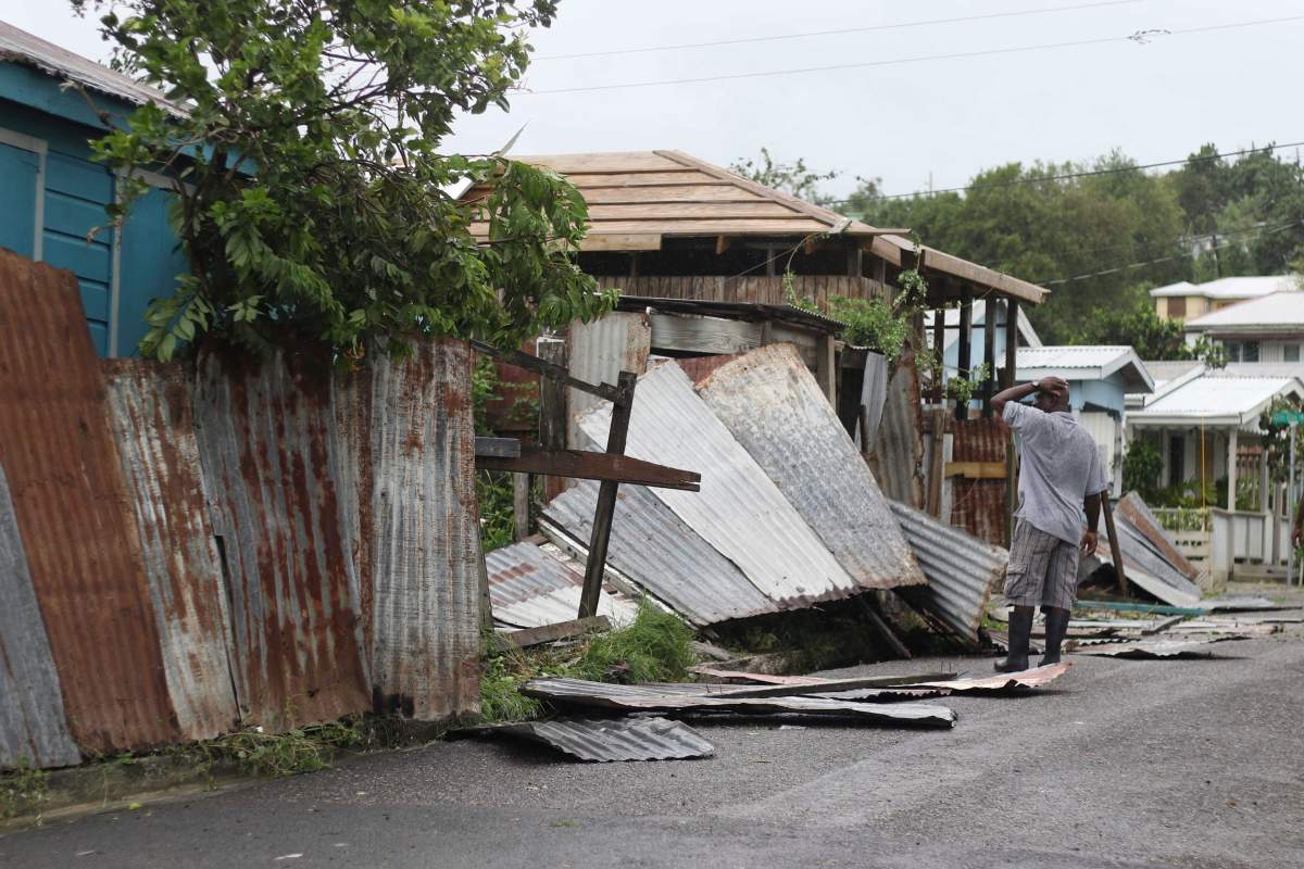 A man surveys the wreckage on his property after the passing of Hurricane Irma, in St. John’s, Antigua and Barbuda, Wednesday, Sept. 6, 2017.