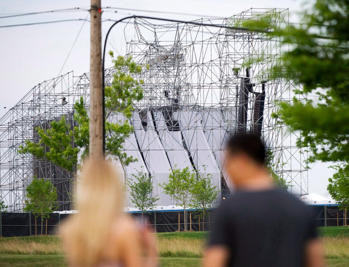 People look at a collapsed stage at Downsview Park in Toronto on June 16, 2012.