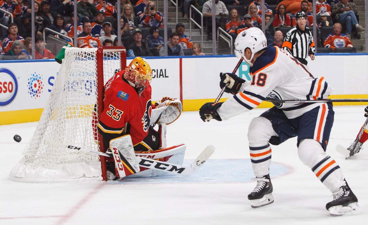 Calgary Flames goalie David Rittich (33) makes the save on Edmonton Oilers forward Ryan Strome (18) during second period NHL preseason action in Edmonton, Alta., on Monday September 18, 2017. 