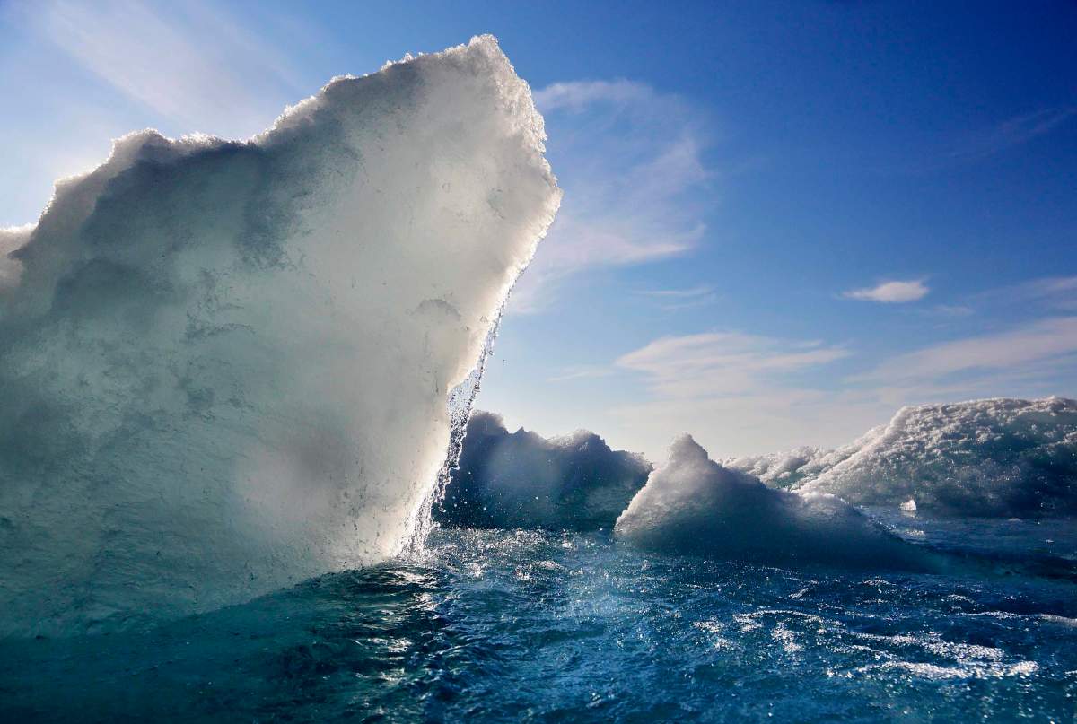 FILE - In this July 21, 2017, file photo, broken sea ice emerges from under the hull of the Finnish icebreaker MSV Nordica as it sails through the Victoria Strait while traversing the Arctic's Northwest Passage. 