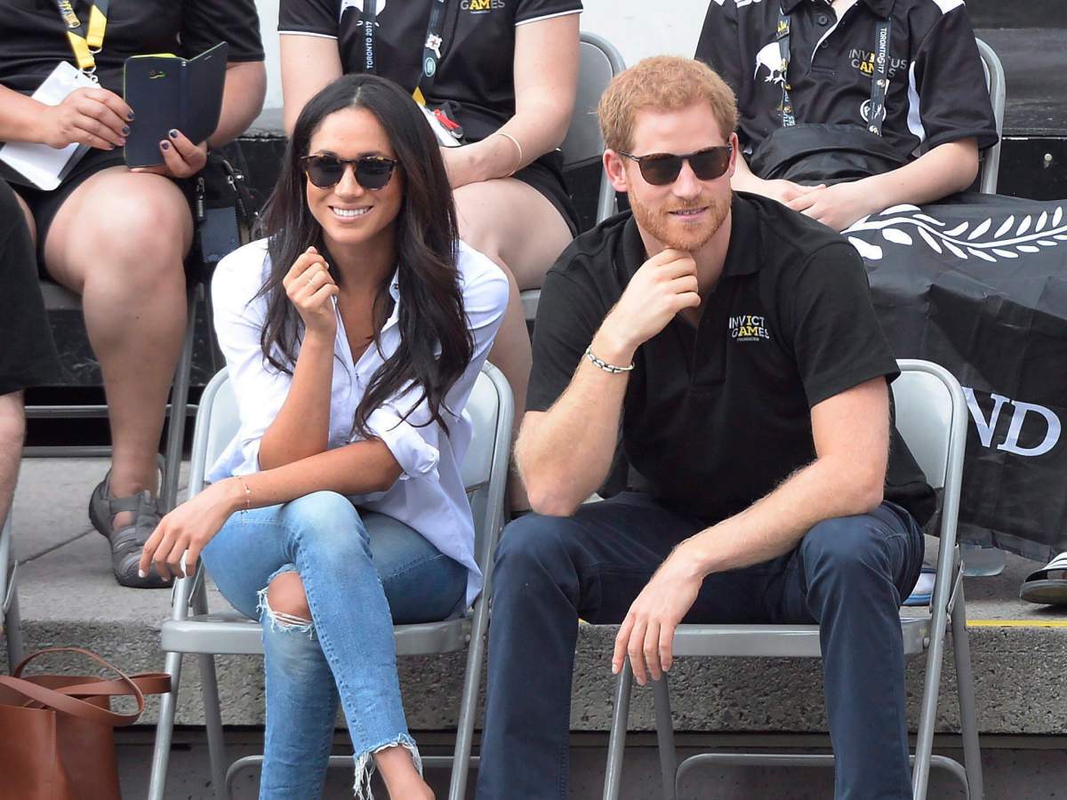 Meghan Markle sits with legs comfortably crossed in Toronto on Monday.