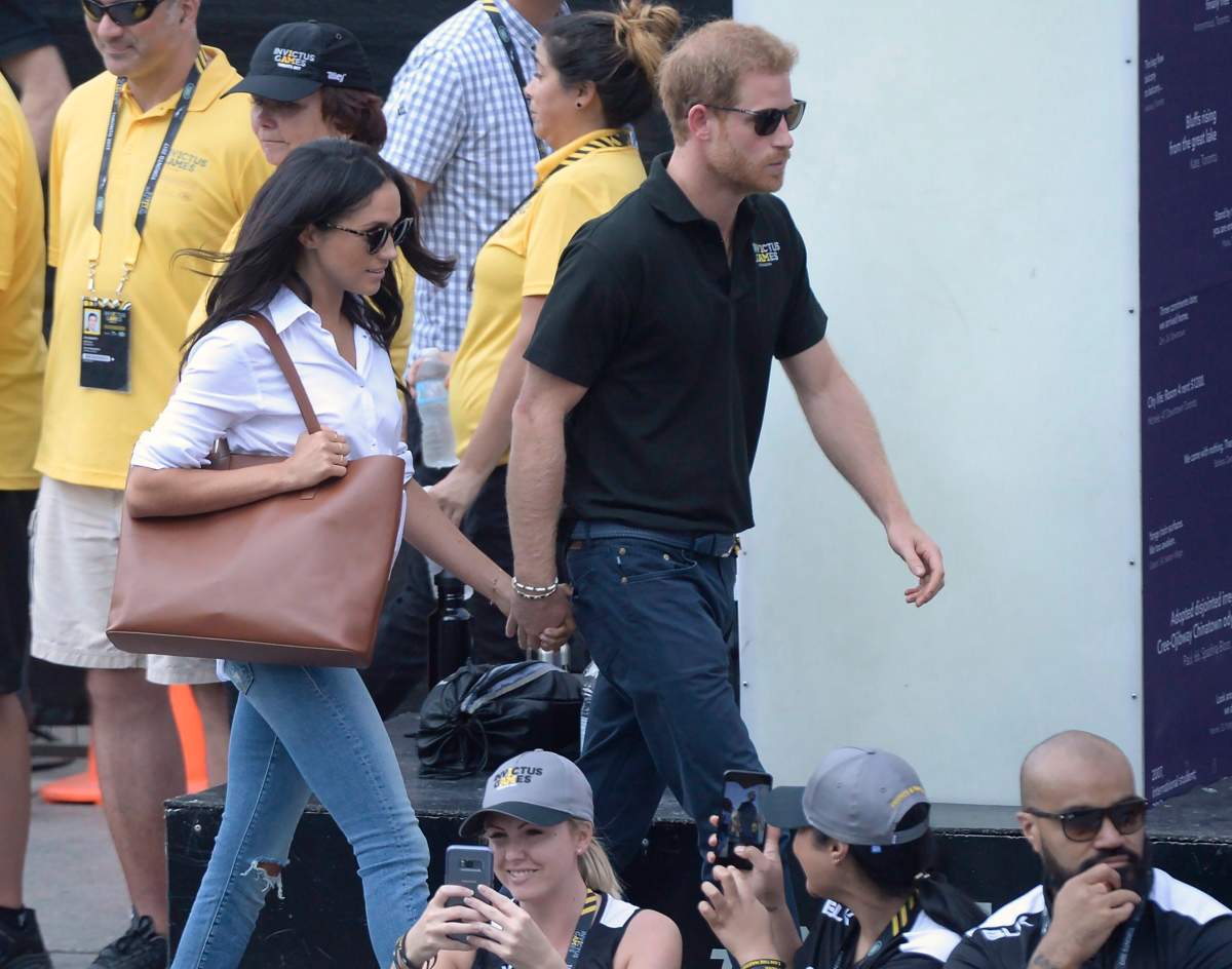 Prince Harry and his girlfriend Meghan Markle arrive at a wheelchair tennis event at the Invictus Games in Toronto, Monday, Sept.25, 2017. THE CANADIAN PRESS/Nathan Denette