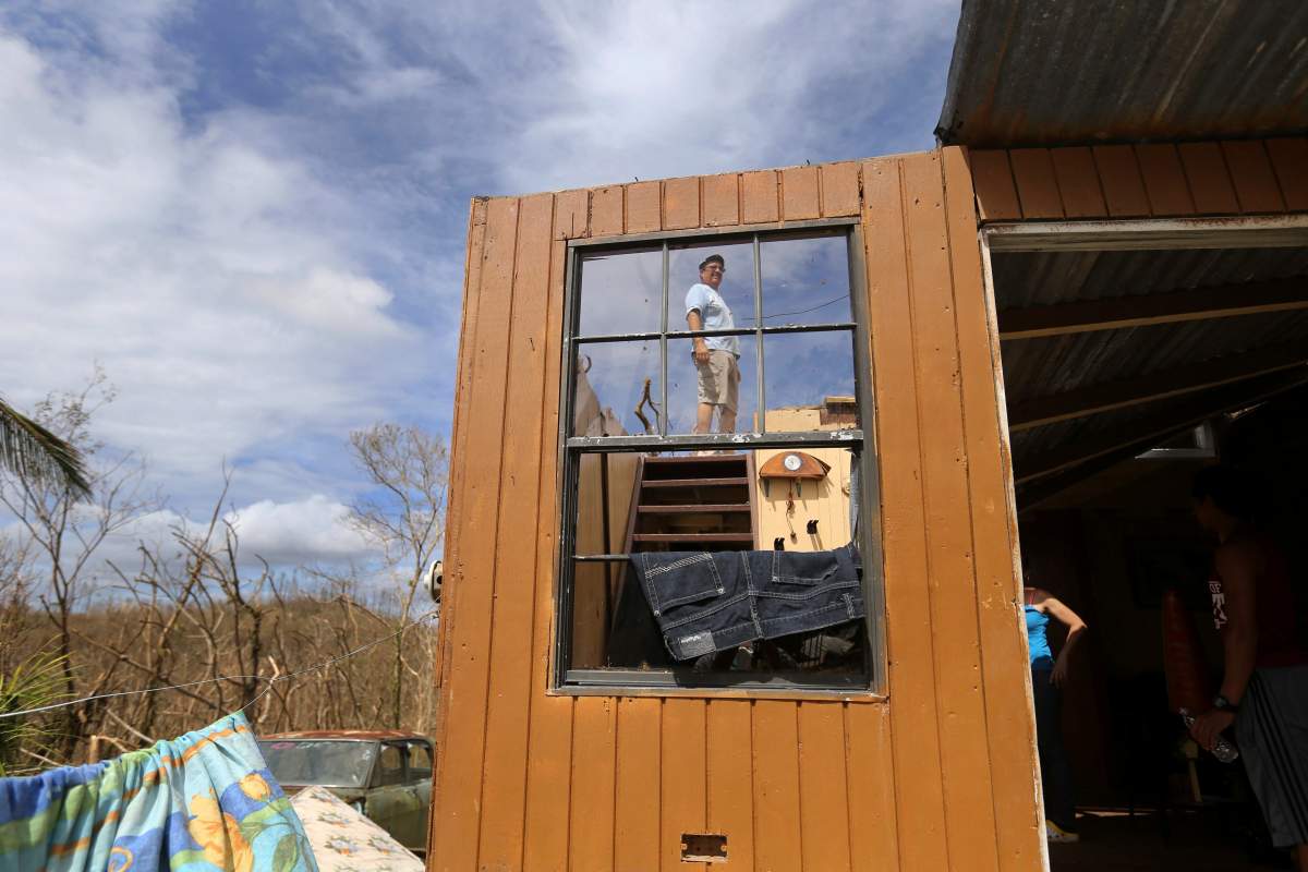 Jose Garcia Vicente shows his destroyed home, in the aftermath of Hurricane Maria, in Aibonito, Puerto Rico, Monday, Sept. 25, 2017.