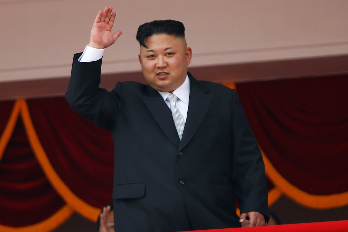 North Korean leader Kim Jong Un waves to people attending a military parade marking the 105th birth anniversary of country's founding father, Kim Il Sung in Pyongyang, April 15, 2017.  