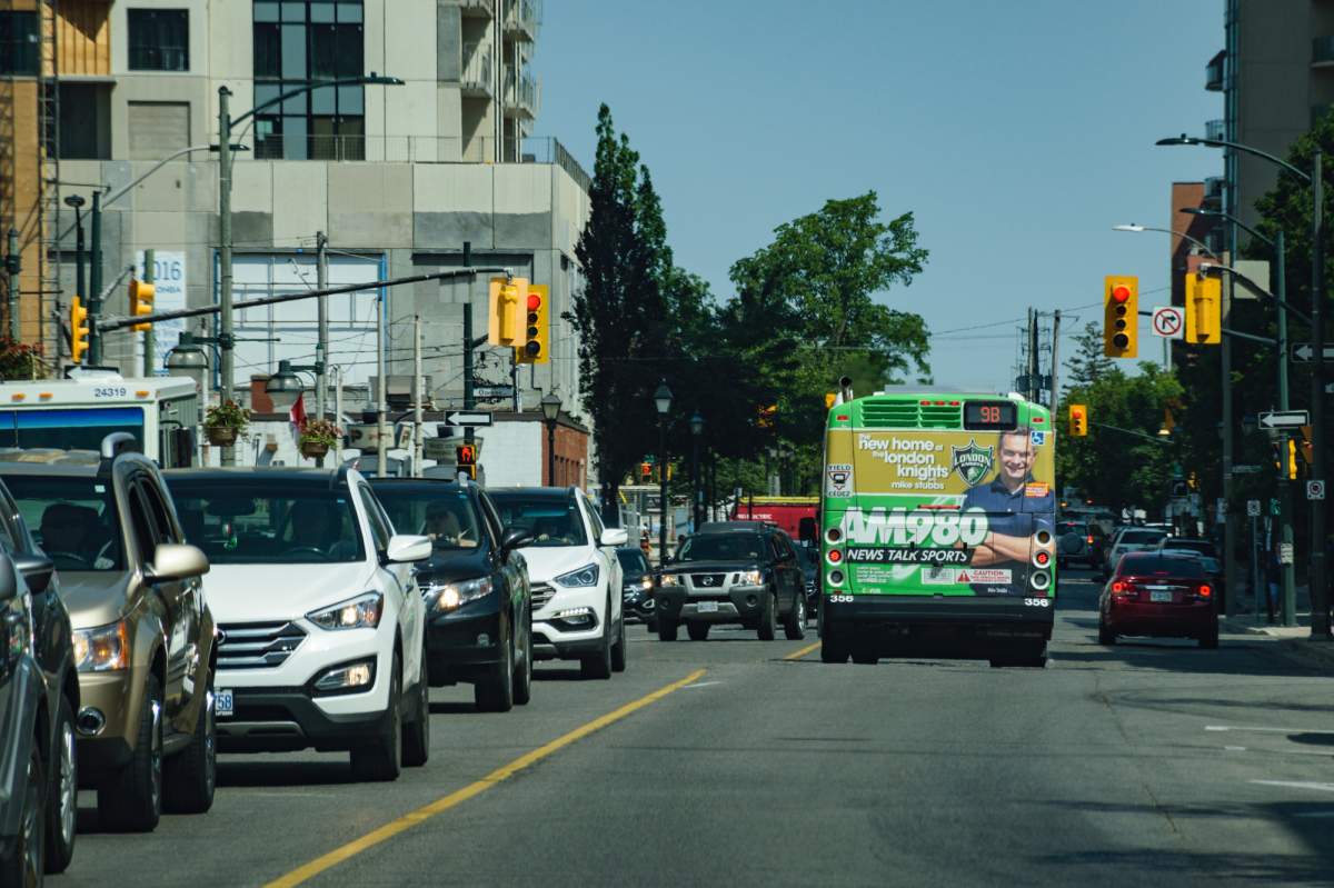 A London Transit bus with AM980 branding travels north along Talbot Street in downtown London on June 14, 2017.
