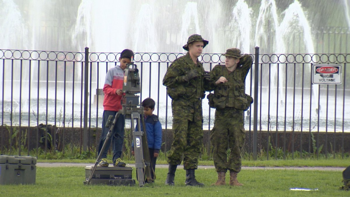 Two kids check out military equipment on the Halifax Common on Sept. 30, 2017.