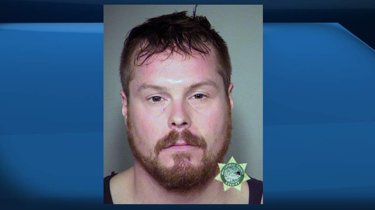 This undated file photo provided by the Multnomah County Sheriff's office shows Joel Dauncey, from Vancouver, British Columbia. Dauncey, who bit a 14-year-old girl on the right breast during a Green Day concert in Portland, Ore., has been sentenced to 30 days in jail. 