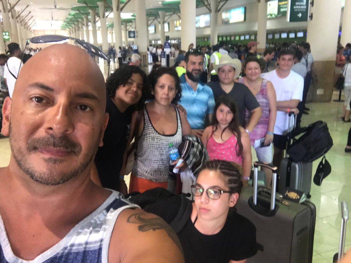 Mauricio Bravo waits for an evacuation flight from Punta Cana with his wife Gina, their kids, Paula and David, and the other Canadian family who let them know about added flights. 
