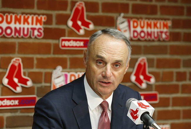 Baseball Commissioner Rob Manfred speaks during a news conference at Fenway Park before a baseball game between the Boston Red Sox and the Toronto Blue Jays in Boston on Tuesday, Sept. 5, 2017.