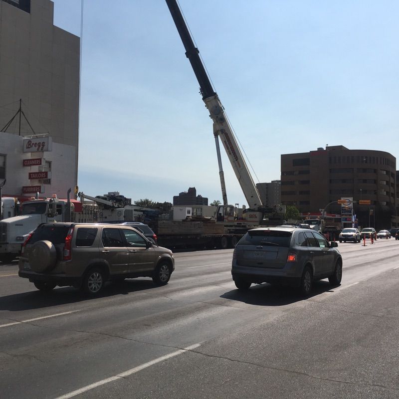 Semi trailers took equipment away from the Capital Pointe construction site.