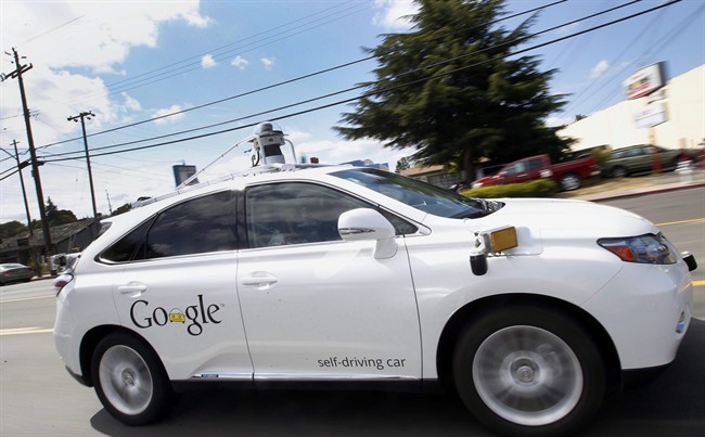 Google's self-driving Lexus car drives along street during a demonstration at Google campus in Mountain View, Calif. 