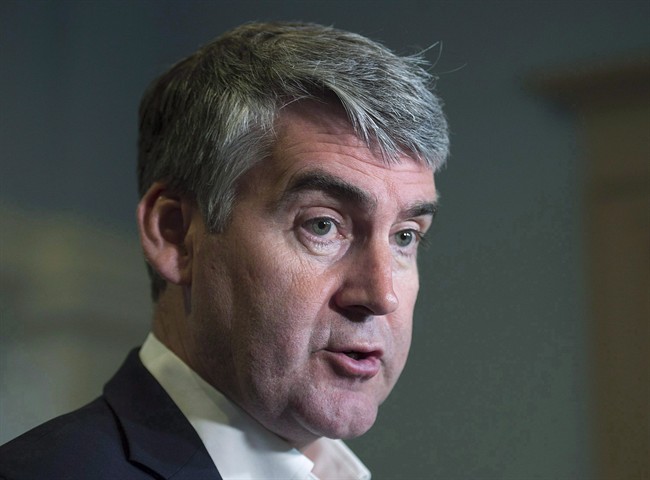 Nova Scotia Premier Stephen McNeil talks with reporters at the legislature in Halifax on Wednesday, May 31, 2017.