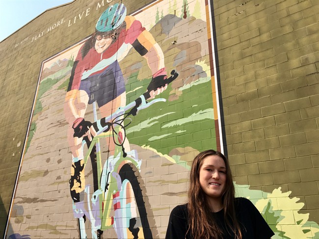 Lea McCroy, 17, poses for a photo in front of a Canmore mural in memory of her mom, Isabelle Dube, who was killed in a grizzly bear attack in June 2005, in Canmore, Alta., on Wednesday, August 30, 2017. The daughter of a Canmore woman who died in a grizzly bear attack in 2005 says she now has a better sense of how her mom felt in the moments before she died. Earlier this summer, Lea McCroy was out for a run at the Canmore Nordic Centre when she heard a crashing sound in the woods. It's strongly believed it was No. 148, a six-and-a-half year old grizzly that was in the area at the time. The bear was relocated a week later to Kakwa Wildland Provincial Park after several close calls with people in the Canmore area. 