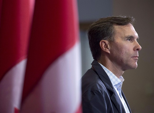 Finance Minister Bill Morneau takes questions as the Liberal cabinet meets in St. John's, N.L. on Sept. 12, 2017.