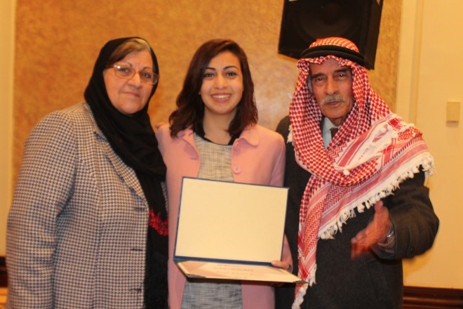 Dana Gibreel receiving her award from JHR.