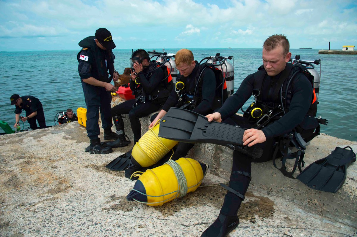 Sailors from the HMCS St John’s are seen gearing up to inspect a jetty in the Turks and Caicos island