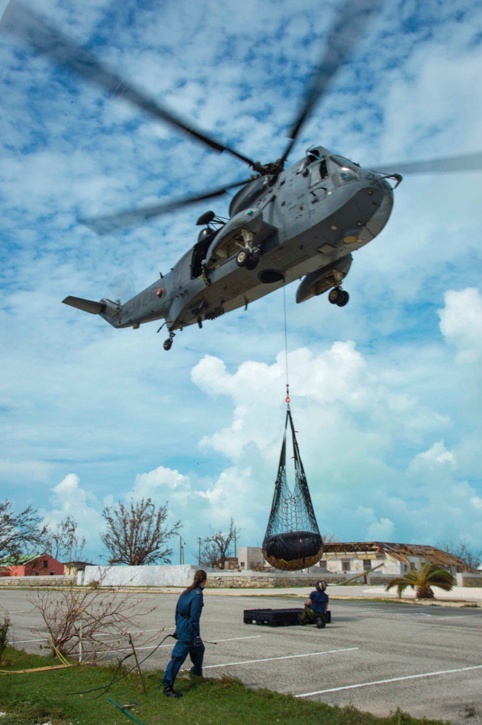 A helicopter from HMCS St. John’s drops of supplies in the Turks and Caicos as part of Operation Renaissance