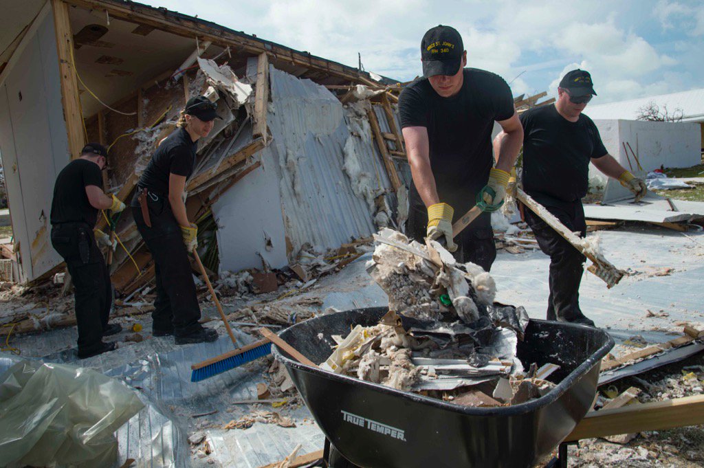 Sailors from HMCS St. John's help clear debris in the Turks and Caicos islands.