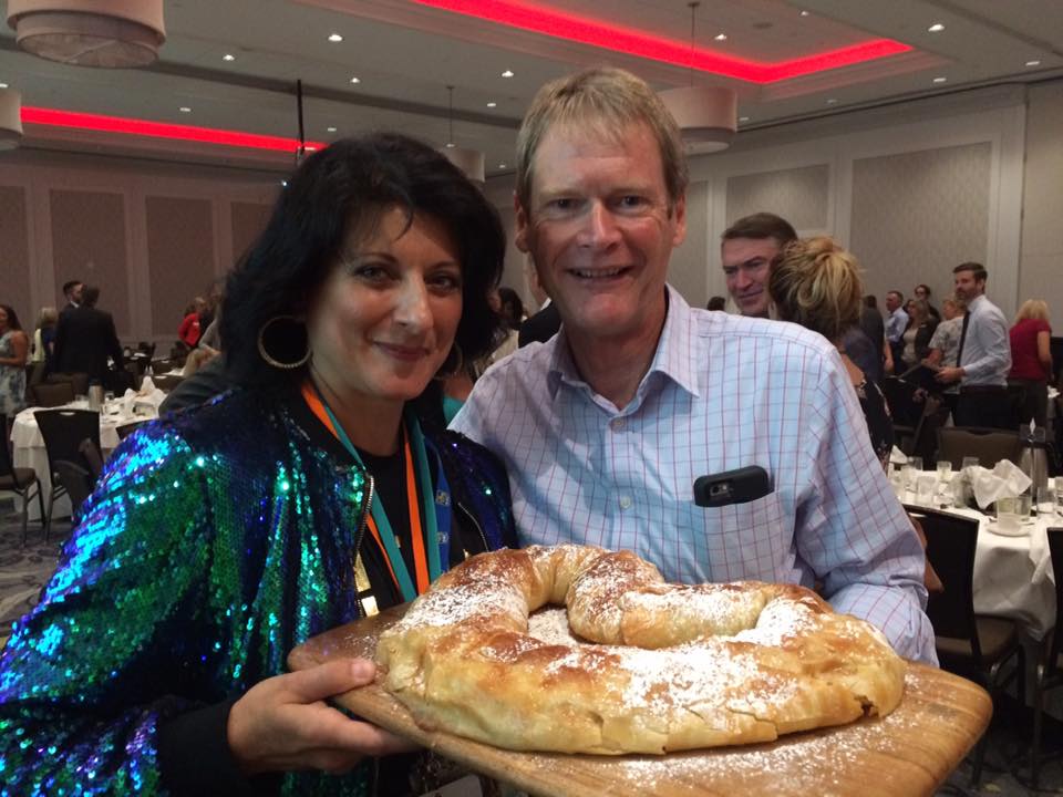 Doris Maria Bregolisse presents her baking to the highest bidder, Nick Arkle of Gorman Bros.