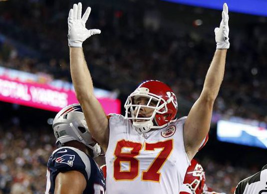 Kansas City Chiefs tight end Travis Kelce celebrates a touchdown by Kareem Hunt during the second half of an NFL football game against the New England Patriots, Thursday, Sept. 7, 2017, in Foxborough, Mass. (AP Photo/Michael Dwyer).