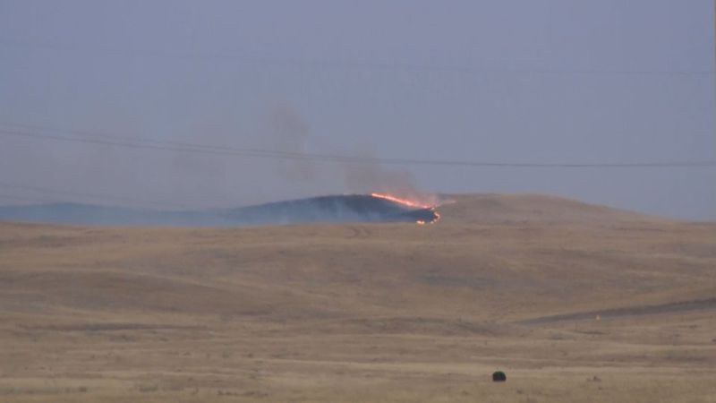 A fire burns in southeastern Alberta south of Oyen near the Saskatchewan border on Tuesday, Sept. 12, 2017.