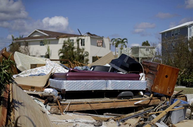 A bed sits amongst the remains of its room in a home demolished from Hurricane Irma in Goodland, Fla., Tuesday, Sept. 12, 2017.